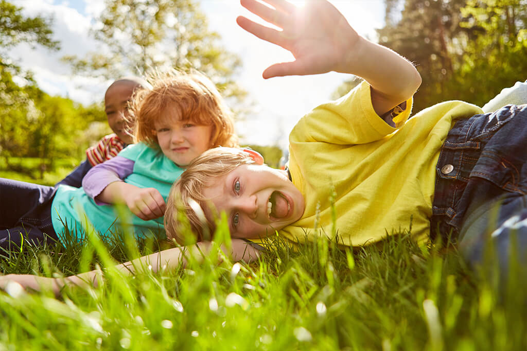 Kids playing in the grass
